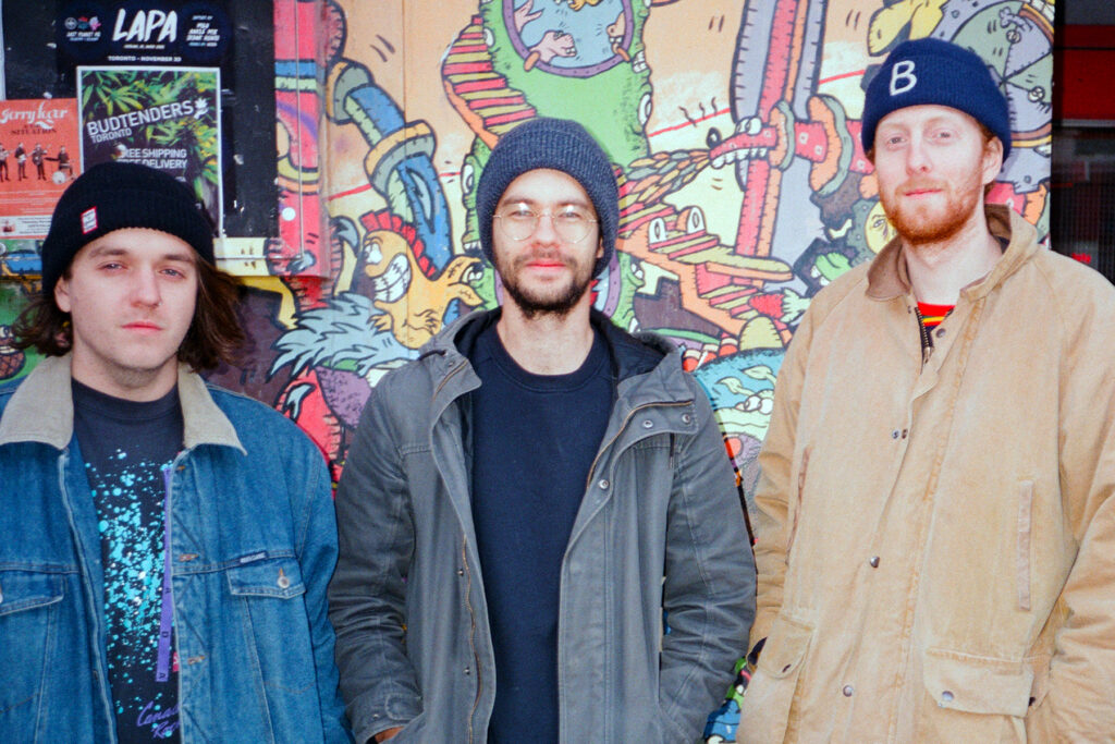 Horror My Friend stand against a colourful wall outside Lee's Palace in Toronto on a cold winter day